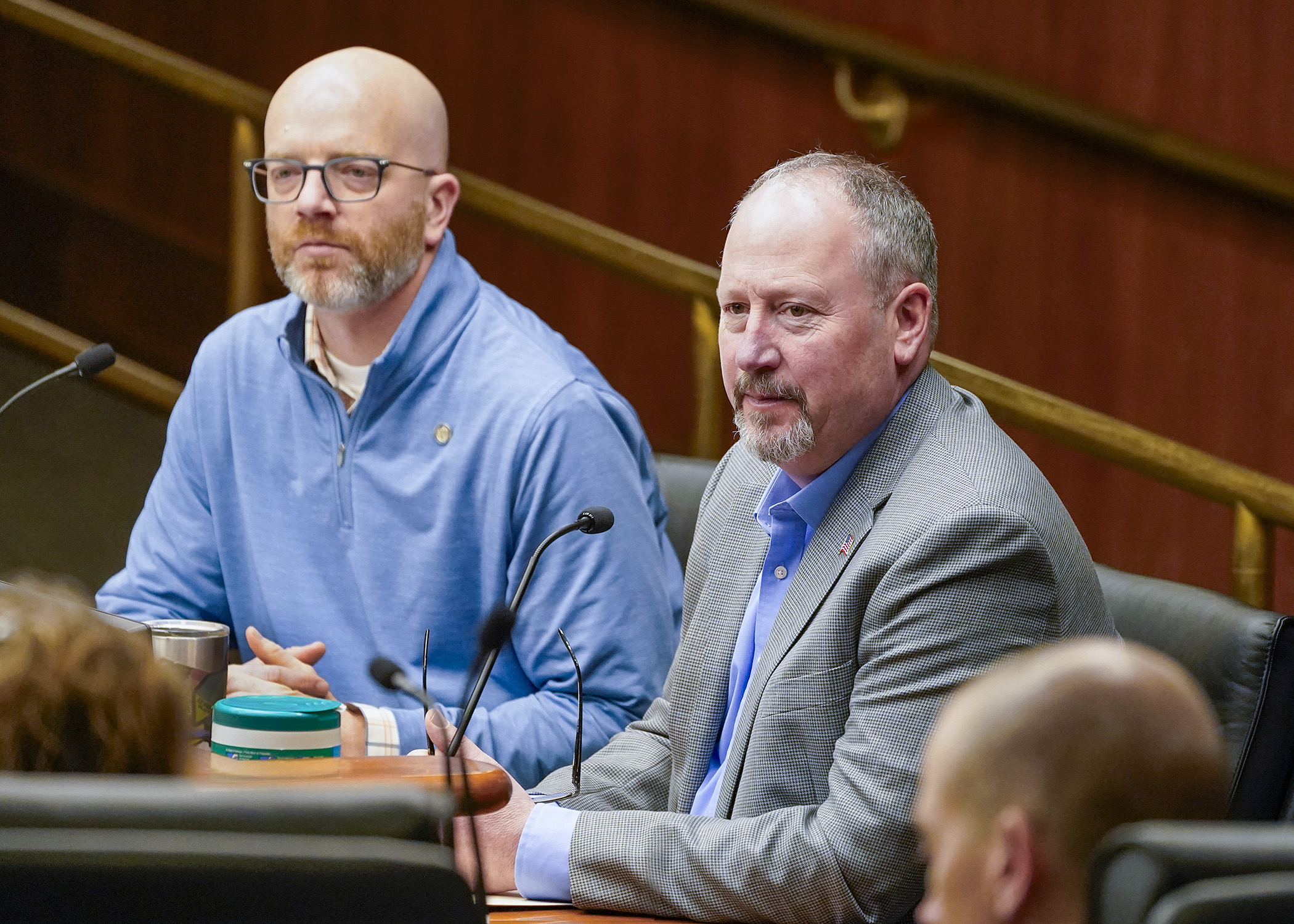 Dave Wager, executive director of the Minnesota Propane Association, testifies before the House Transportation Finance and Policy Committee in support of a bill sponsored by Rep. Brad Tabke, left, that would amend petroleum product transporting requirements. (Photo by Andrew VonBank)